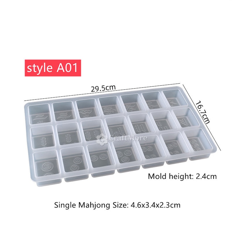May include: A white plastic mold for making mahjong tiles. The mold is 29.5 cm long, 16.7 cm wide, and 2.4 cm high. The mold has 20 individual squares, each measuring 4.6 cm x 3.4 cm x 2.3 cm. The mold is labeled "style A01".
