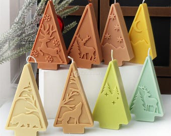 May include: Eight different Christmas tree shaped candles with various designs. The candles are brown, yellow, green, and light green. The designs include a deer, a wolf, a bear, a moon, stars, and trees.
