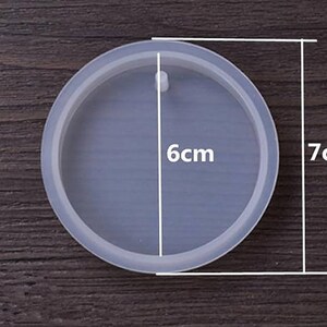 May include: A clear round silicone mold for resin crafts. The mold is 7 inches in diameter and 6 inches in width.
