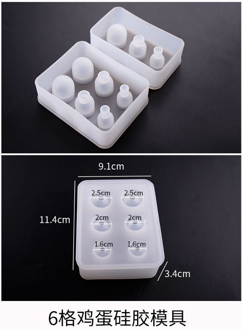 Op de afbeelding: Witte siliconen mal met zes ronde holtes voor het maken van hars ambachten. De mal is 9,1 cm breed, 11,4 cm lang en 3,4 cm diep. De holtes zijn 2,5 cm, 2 cm en 1,6 cm in diameter.