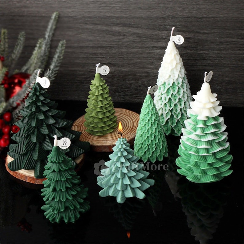May include: Assortment of green and white Christmas tree candles. The candles are made of wax and have a realistic tree design.