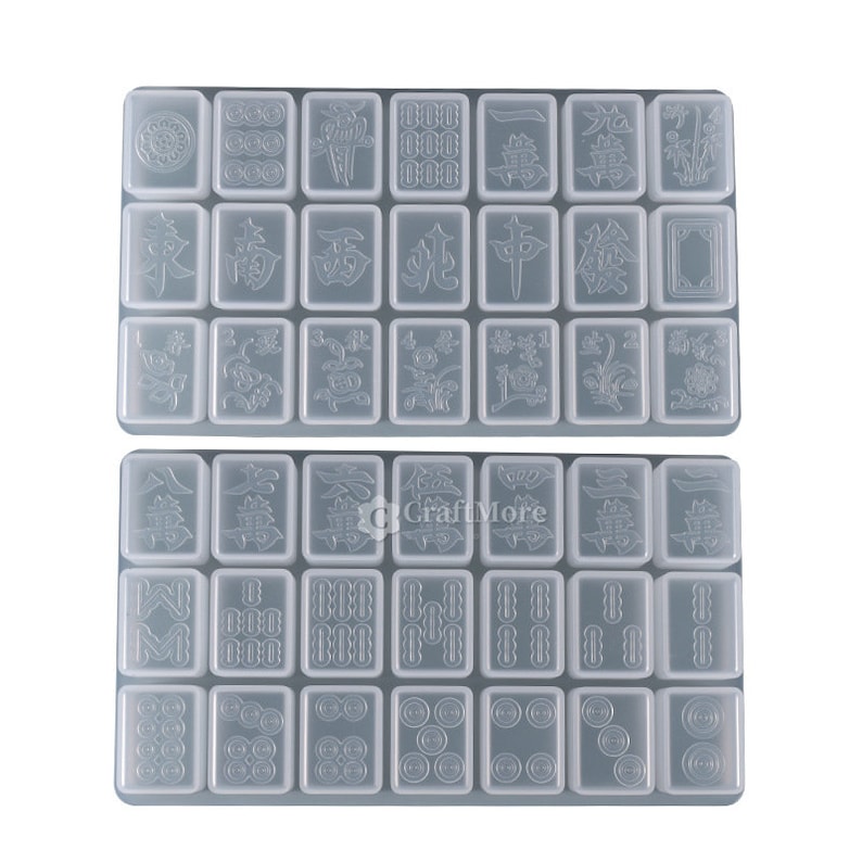 May include: Two clear plastic trays with 24 individual molds for making resin mahjong tiles. Each mold features a different mahjong tile design.