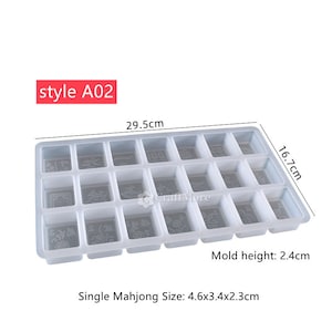 May include: White plastic mold with 20 individual square compartments for making mahjong tiles. The mold measures 29.5 inches by 16.7 inches and is 2.4 inches high. Each compartment is 4.6 inches by 3.4 inches by 2.3 inches.
