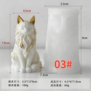 May include: A white cat figurine with gold accents, measuring approximately 3.1 inches tall. Beside it is a white mold with the number "03#" on it. The cat figurine is a decorative item.