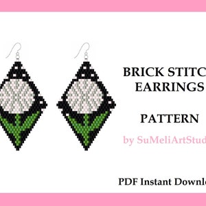 May include: A pair of diamond-shaped brick stitch earrings with a floral design. The earrings feature a white flower with black and green accents. The image also includes the text "BRICK STITCH EARRINGS PATTERN" and "PDF Instant Download".