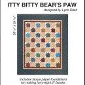 May include: A quilting pattern for a quilt called "Itty Bitty Bear's Paw" designed by Lynette Roach. The pattern includes tissue paper foundations for making forty-eight 2 1/2 inch blocks.