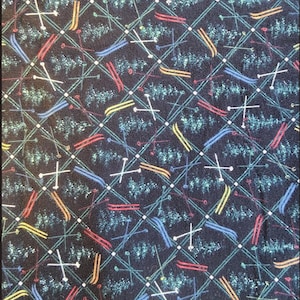 May include: A dark blue fabric with a repeating pattern of skis, ski poles, and a forest-like design. The skis are in red, yellow, and blue, and the ski poles are white. The pattern is set against a grid of green lines.