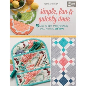 May include: A craft book titled Simple, Fun & Quickly Done by Terry Atkinson featuring 18 sewing projects. The cover displays citrus-shaped fabric coasters, a floral print sewing organizer with tools, and a geometric quilted table runner pattern.