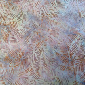 May include: A close-up of a fabric with a pattern of brown and white lines. The fabric has a soft, textured feel and a subtle sheen.