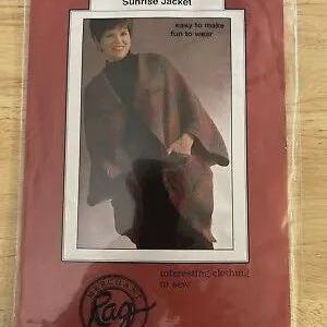 May include: A sewing pattern envelope for a Sunrise Jacket featuring a photograph of a person wearing a dark, open-front jacket with a plaid pattern. The packaging includes the text Sunrise Jacket, easy to make fun to wear, and Merchant & Mills Rag.