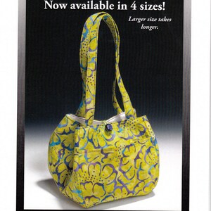 May include: A yellow and blue floral patterned tulip purse with matching handles. The purse has a button closure and a pocket on the side. Text on the image reads "The Two-Hour Tulip Purse Bouquet" and "Now available in 4 sizes!"