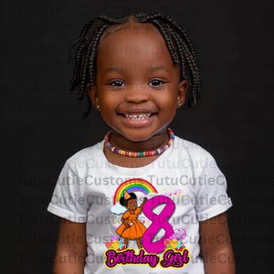 May include: A white t-shirt with a colorful rainbow, a girl holding a microphone, and the number 8 in pink with the text "Birthday Girl".