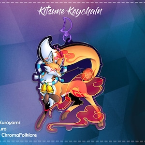 May include: Kitsune Keychain with a vibrant illustration of a fox spirit. The keychain features a fox with orange, white, and black fur, adorned with bells and a flowing tail. The text "Kitsune Keychain" is at the top.