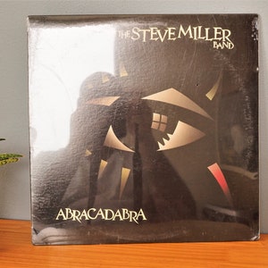 The Steve Miller Band Abracadabra lp Vinyl Record 33 Rpm EMI/Capitol ST--512216 Abracadabra Cool Magic Sealed Free Shipping