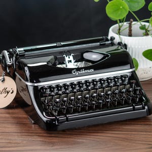 ENVIO RÁPIDO DE 1 A 3 DIAS Máquina de escrever Optima Elite, anos 1950, com manutenção profissional e funcionando, com fita de tinta nova, frete grátis