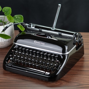ENVIO RÁPIDO DE 1 A 3 DIAS Máquina de escrever Optima Elite, anos 1950, com manutenção profissional e funcionando, com fita de tinta nova, frete grátis