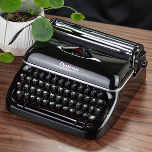 ENVÍO RÁPIDO DE 1 A 3 DÍAS Máquina de escribir Optima Elite 3, años 50, con mantenimiento profesional y en funcionamiento, con cinta de tinta nueva, envío gratuito