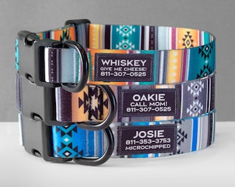 May include: Three colorful dog collars with black buckles and personalized name tags. The top collar is turquoise, orange, and white with the name "WHISKEY" and the text "GIVE ME CHEESE! 811-307-0525". The middle collar is gray, orange, and black with the name "OAKIE" and the text "CALL MOM! 811-307-0525". The bottom collar is blue, gray, and white with the name "JOSIE" and the text "811-353-3753 MICROCHIPPED".