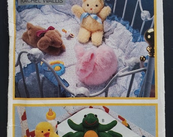 May include: A sewing pattern for making stuffed toys. The pattern includes instructions for making a teddy bear, a turtle, a frog, a chick, and a puppy. The pattern is from Butterick and the pattern number is 4897.