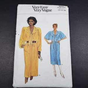 May include: A sewing pattern for two dresses, one yellow and one blue, with a tie at the neck. The pattern is for sizes 14-16-18. The pattern is called "Very Easy Very Vogue" and the pattern number is 9206.