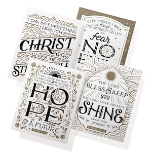 May include: Four white cards with inspirational quotes in black and brown lettering. The cards feature phrases like "Christ who gives me strength" and "Hope & a future." The designs include decorative borders and sun motifs.