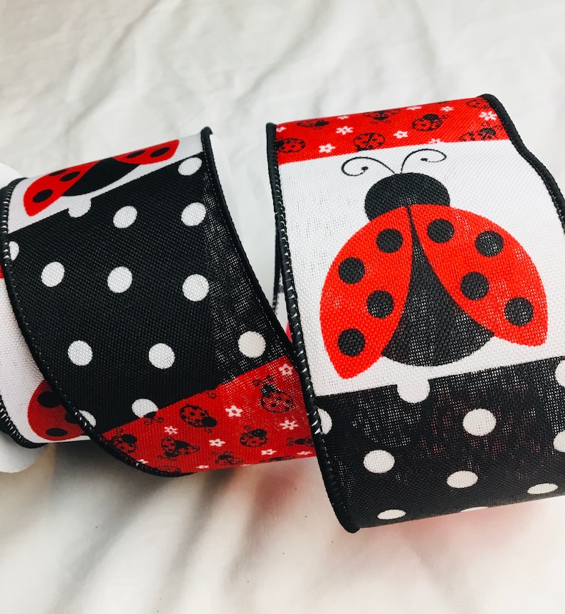 May include: Black and white polka dot ribbon with red and black ladybugs. The ribbon also features a white panel with a large red ladybug with black spots.