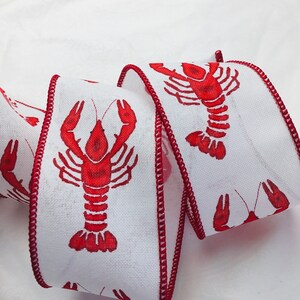 Lobster/Crawfish on white or beige ribbon.