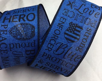 May include: Blue and black ribbon with the words "Protect & Serve", "Hero", "Peacemaker", "Blue", "Police", "Enforcer", "Proud", "Strong", and "Love" printed on it.