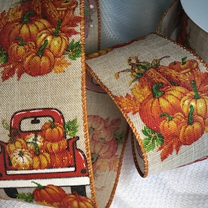 Pumpkins in red farm truck bed