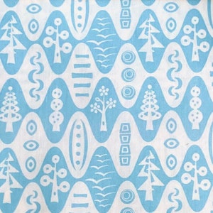 May include: A blue and white fabric with a repeating pattern of stylised trees, wavy lines, and geometric shapes. The design is reminiscent of mid-century modern style.