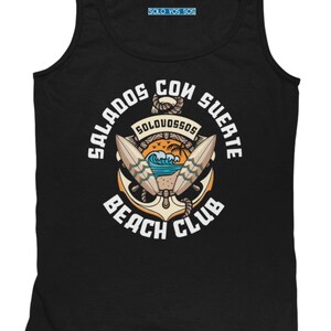 May include: Black tank top with a beach club graphic. The graphic includes an anchor, surfboards, and the words "Salados Con Suerte Beach Club" in white. The top also has the text "Solo Vos Sos" in a small blue rectangle.