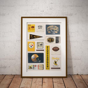 May include: A framed wall art print featuring a collage of vintage Pittsburgh Steelers matchbook covers and memorabilia. The collection includes various yellow, black, and white designs with team logos, football graphics, and text like Steel City.