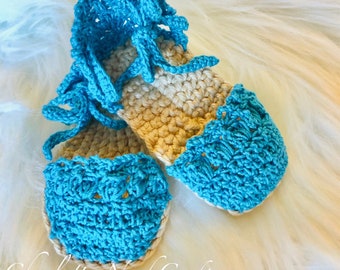 Baby espadrilles crocheted with turquoise and tan yarns