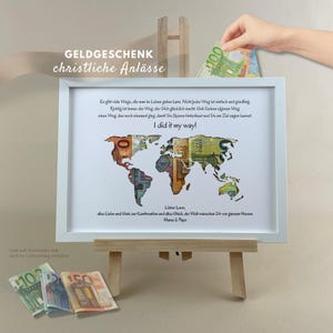 May include: A white framed print featuring a world map cutout filled with colorful euro banknotes. The text reads: Es gibt viele Wege, die man im Leben gehen kann. I did it my way! Lieber Loon, alles Liebe und Gute zur Konfirmation.