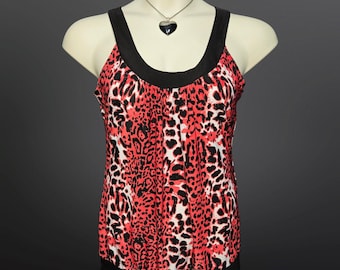 May include: A red and black sleeveless top with a leopard print pattern. The top has a scoop neck and a black band around the neckline.