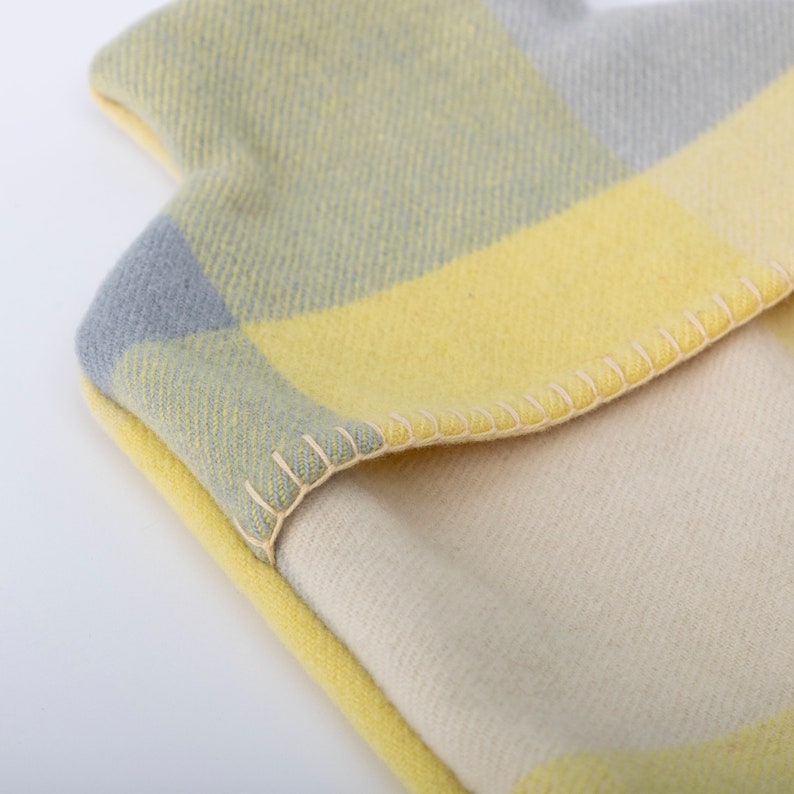 lemon & grey hot water bottle cover - close up photo f the blanket stitching on edge