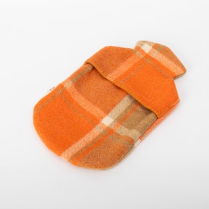 orange, woollen hot water bottle cover