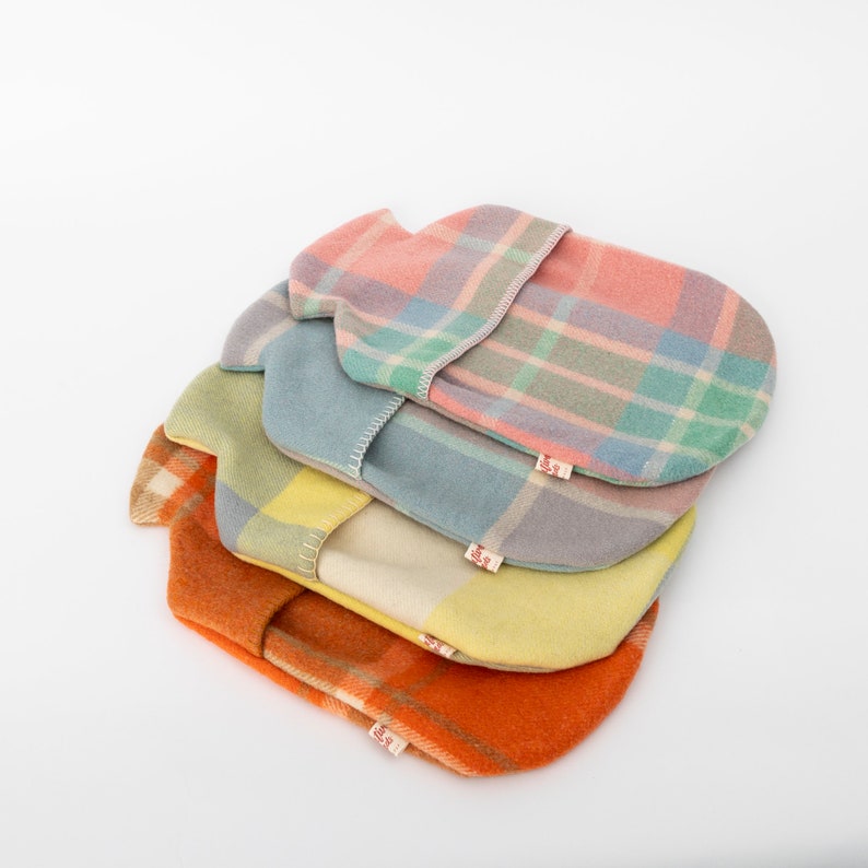 woollen hot water bottle covers - four colour styles stacked