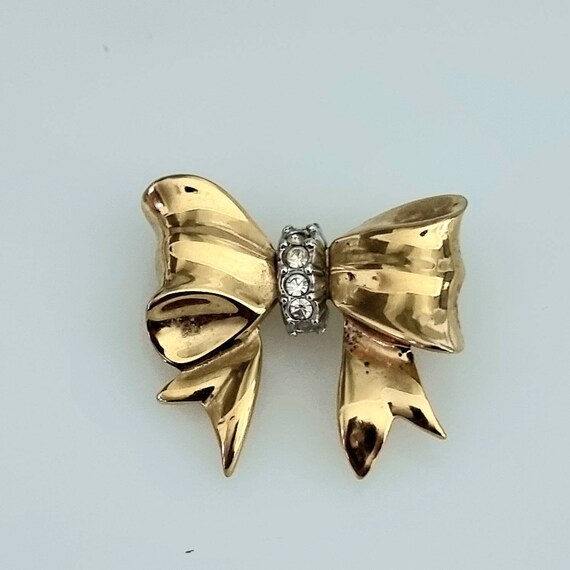 Nina ricci brooch deals