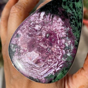 May include: A rustic wooden sign with the text "Welcome to our home" in white lettering. The sign features a distressed finish and a simple, inviting design, perfect for entryway decor.