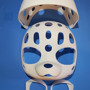 May include: A white, 3D-printed mask kit consisting of a dome-shaped top piece, a main face plate with large eye and nose openings, and two separate circular eye-rim components. The pieces feature a smooth finish with multiple ventilation holes.