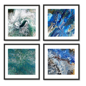 May include: Set of four framed abstract paintings with swirling blue, green, and white paint. The paintings are in black frames and are arranged in a grid.