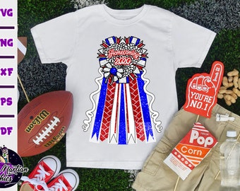 May include: White t-shirt with a red, white, and blue homecoming ribbon design. The ribbon has the text "Homecoming 2020" on it.