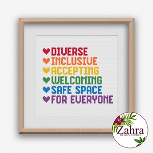 May include: A framed cross-stitch design with a rainbow of hearts and the text "Diverse, Inclusive, Accepting, Welcoming, Safe Space, For Everyone".