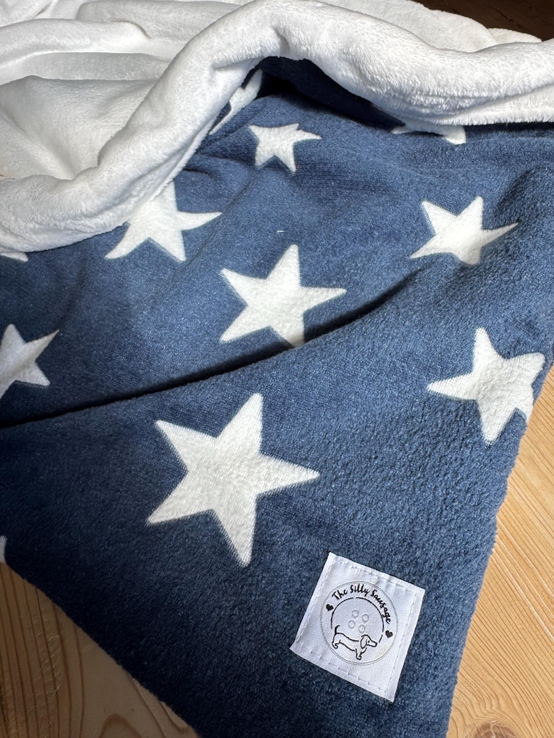 snuggle sacks and blankets perfect for dogs and cats in a lovely navy star design.  cute and cosy. perfect for at home and travel