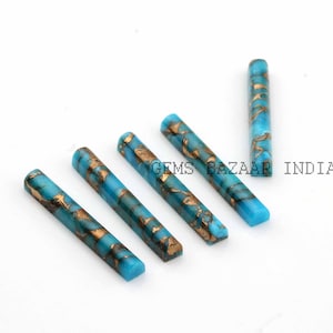 Puede incluir: Cinco cabujones de piedra preciosa turquesa y oro en forma rectangular. Los cabujones miden aproximadamente 2,5 cm de largo y tienen un acabado liso y pulido.