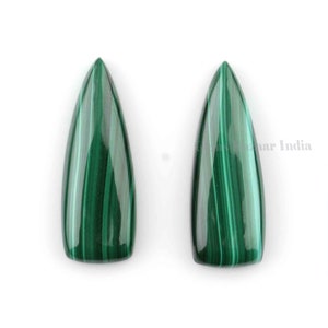 May include: Two green malachite cabochons with a pointed tip and a smooth, polished surface. The stones have a striated pattern.