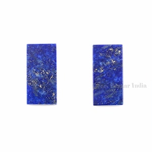 Puede incluir: Dos piezas rectangulares de piedra preciosa de lapislázuli. Las piedras son de color azul intenso con motas de pirita dorada.