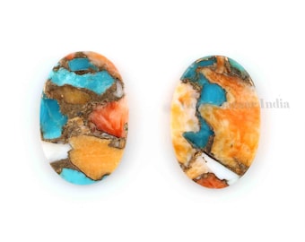 Peut inclure: Deux cabochons ovales de turquoise, corail et or. Les pierres sont un mélange de bleu, d'orange et d'or.
