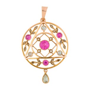 May include: A gold pendant with a circular design, featuring a central pink gemstone and smaller pink gems, pearls, and light blue stones. The pendant has a triangular pattern and a teardrop-shaped light blue stone hanging from the bottom.